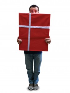 man holding a large birthday gift